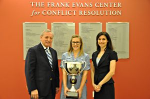 Amanda Gordon (center) holds her first-place trophy from the Jeffry S. Abrams National Mediator Competition, standing alongside STCL Houston President and Dean Donald J. Guter (left) and Debra Berman, director of the school’s Frank Evans Center for Conflict Resolution